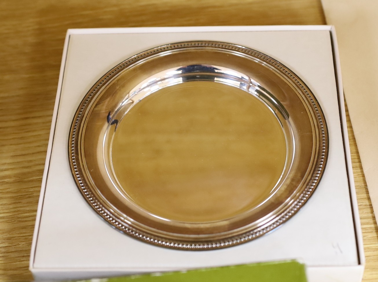 A boxed French Cristofle plated salver a boxed paper knife, dish and rose bowl, salver 35 cms diameter